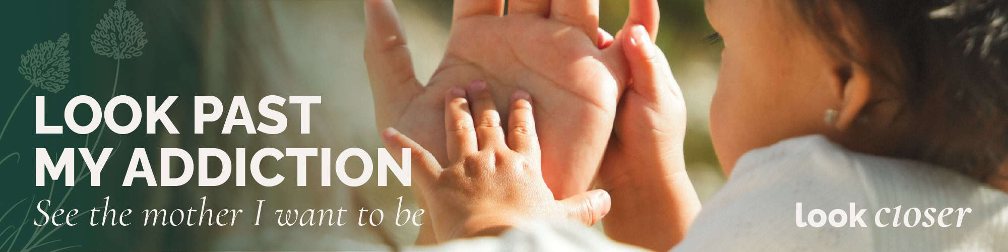 Photo of a mother's hand holding a baby's hand