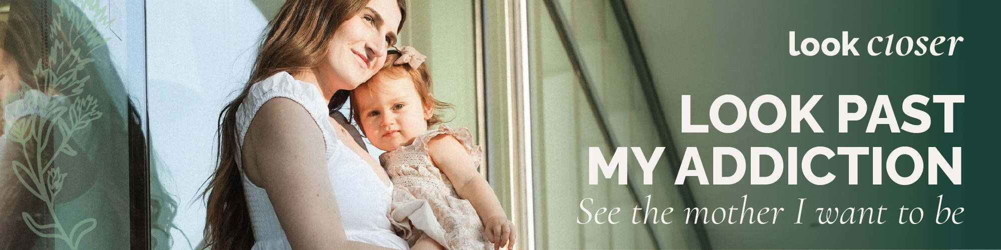 photo of a mother holding her baby in the sun